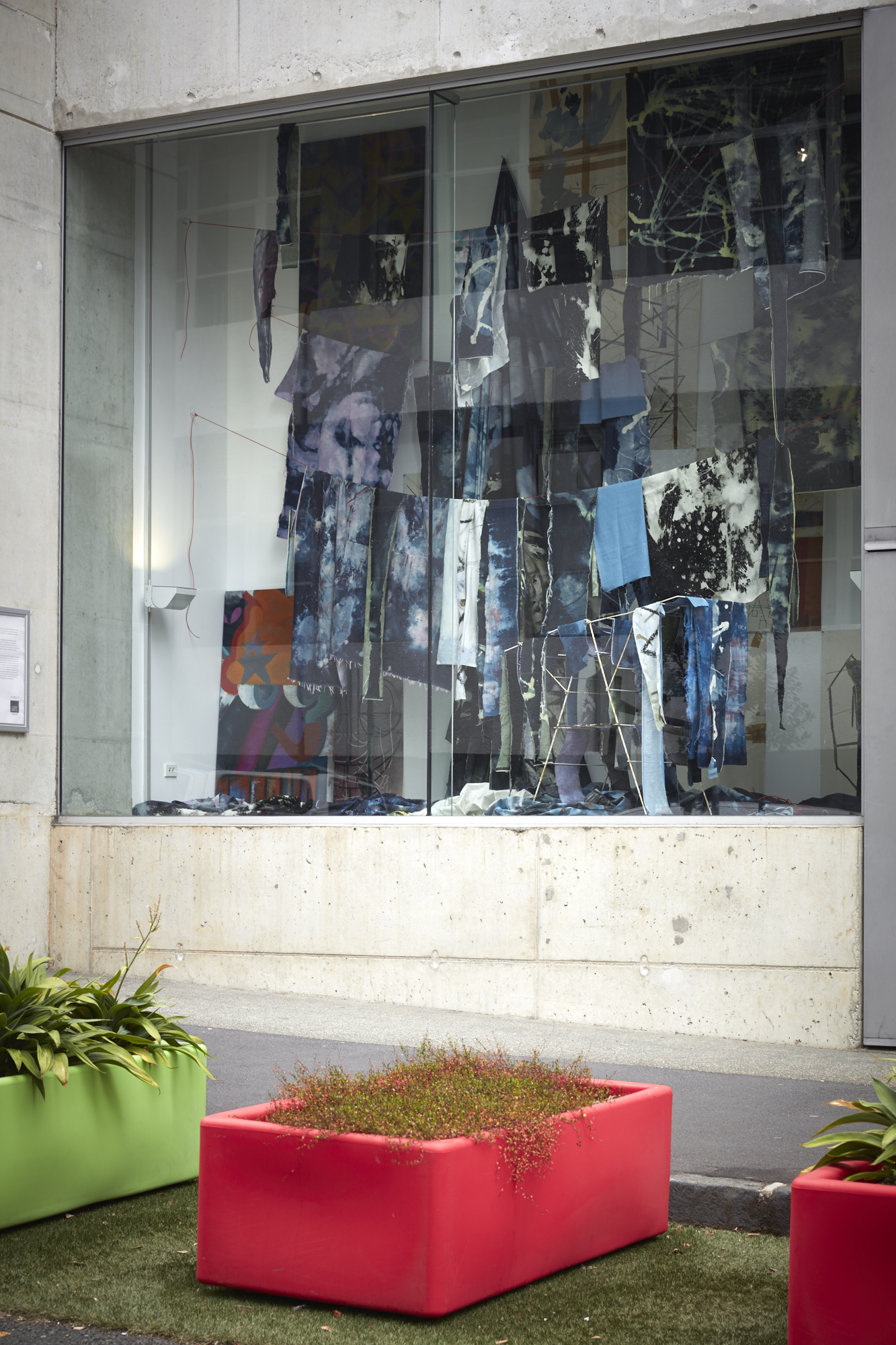denim artwork, hanging in window. Photograph taken from street view