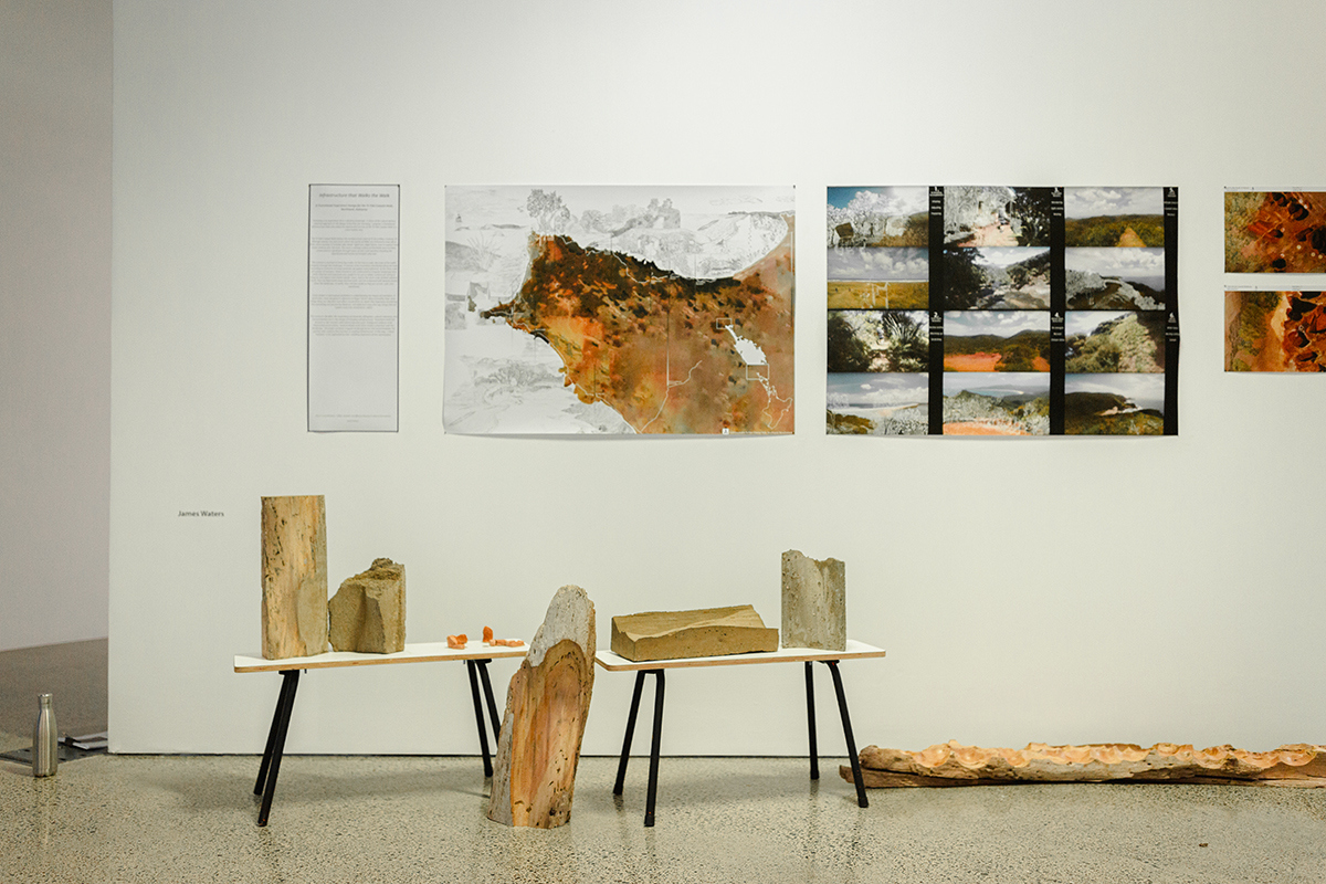 Wood displayed on low tables, prints on wall