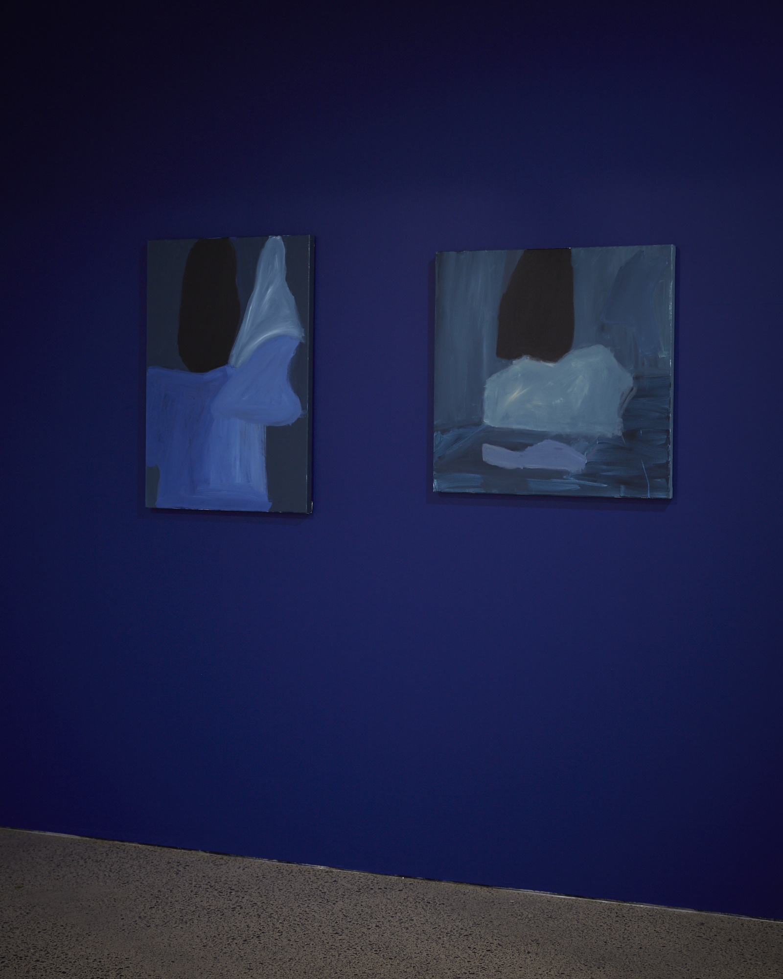two paintings, blue wall