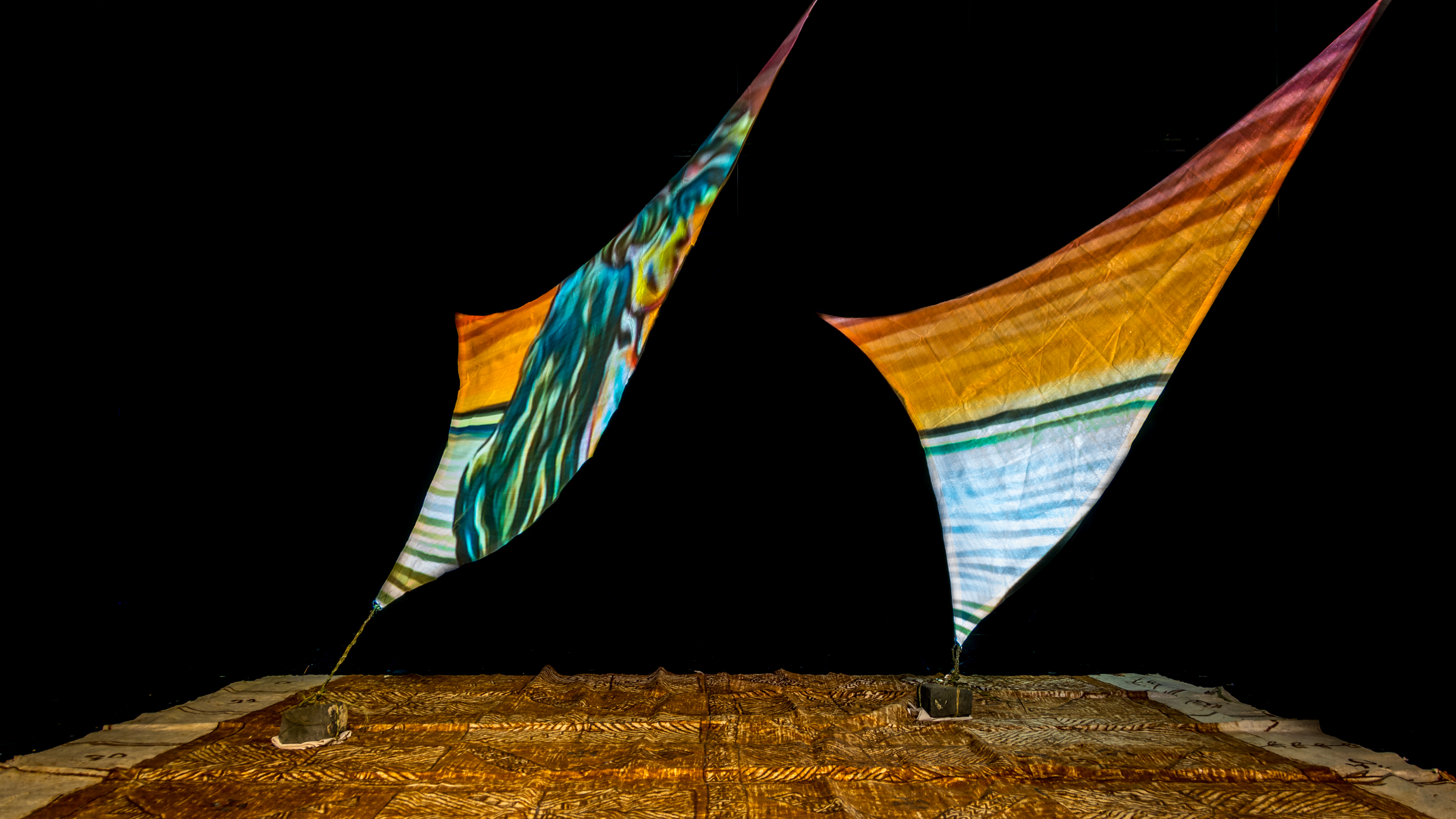 Projections onto rā sails installed with tapa underneath